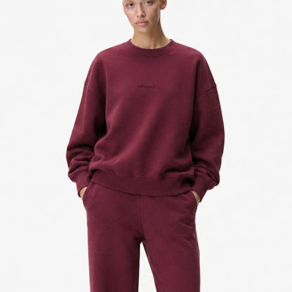 Closer view of the FineAF Visionary wine sweatshirt fit, tonal chest design and ribbed finish