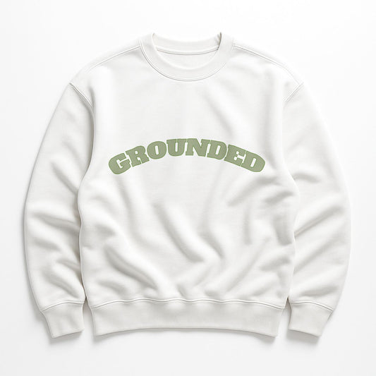 GROUNDED Sweatshirt in white organic cotton fleece with sage green text, minimalist product flat lay.